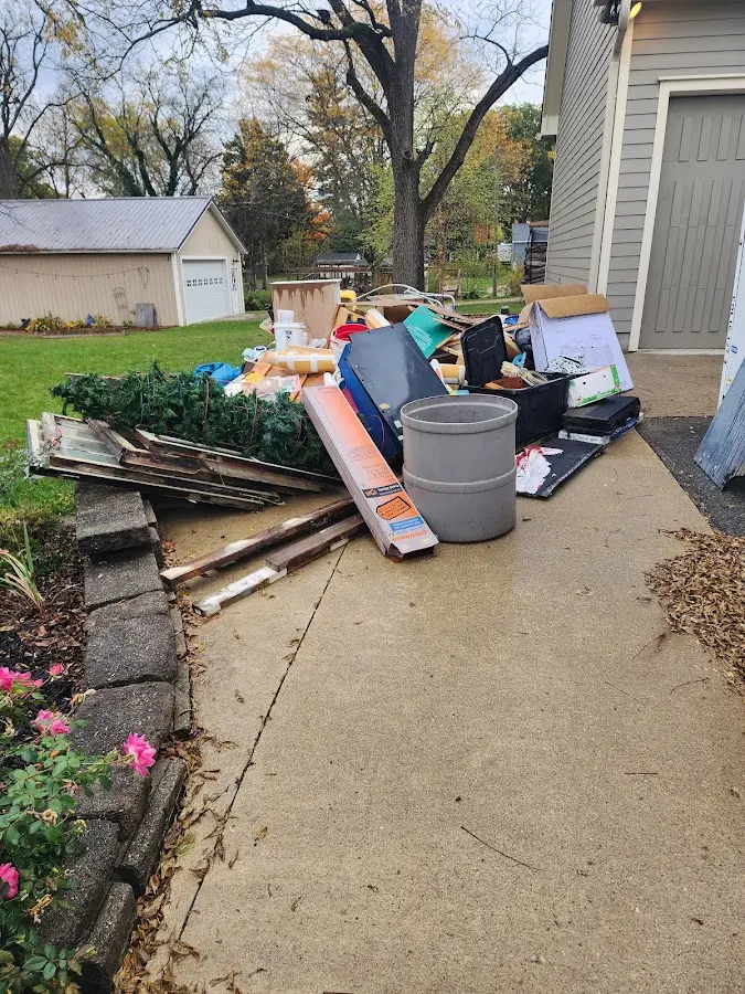 Dumpster being loaded with debris for Estate Cleanout Dumpster Rental in Watsonville